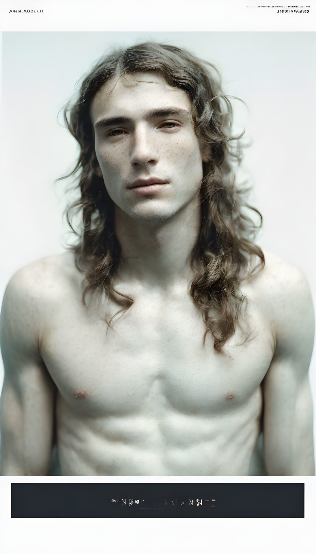 Portrait of Shirtless Young Man with Shoulder-Length Wavy Hair