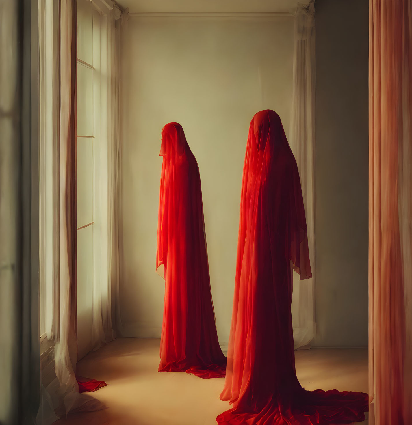 Two figures in red fabric in room with sheer curtains: eerie ambiance