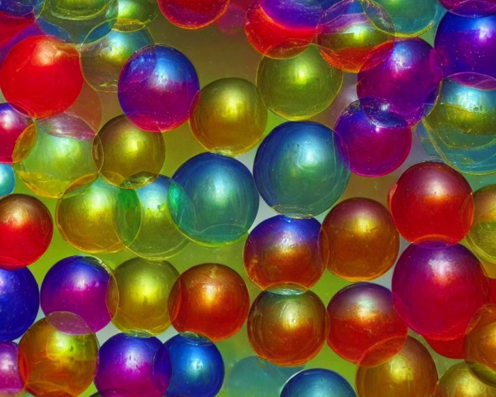 Vibrant translucent marbles in red, green, blue, and yellow hues.