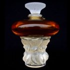 Red and Clear Glass Perfume Bottle with Ornate White Details