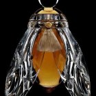 Luxurious Glass Perfume Bottle with Golden Hue and Silver Bee Design