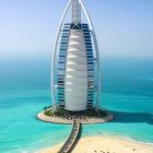 Vibrant digital artwork of Burj Al Arab in Dubai with desert and sea motifs