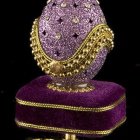 Luxurious Purple and Gold Egg with Floral Patterns on Golden Stand