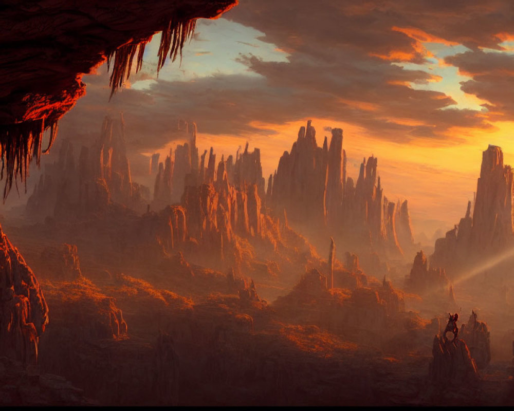 Vibrant sunset over rugged landscape with towering rock formations and stalactites.