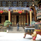 Vibrant Traditional Chinese Building with Red Pillars and Golden Doors