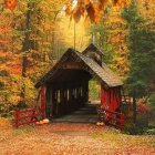 Illustrated wooden covered bridge in vibrant autumn foliage