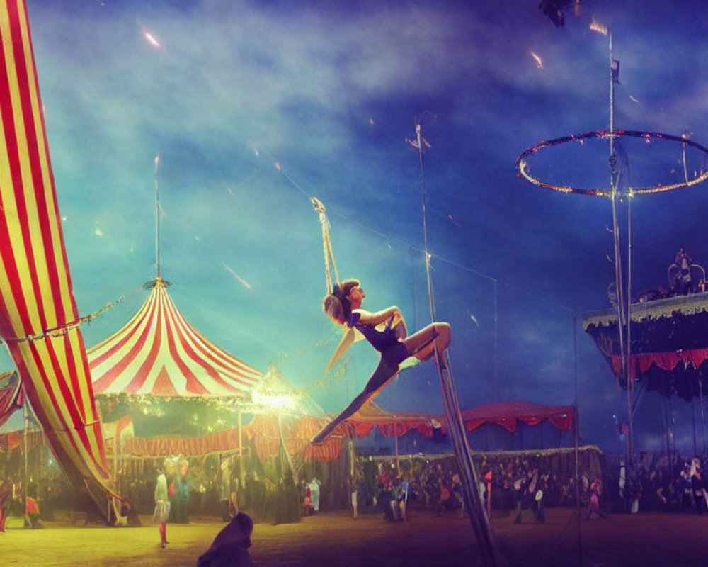 Aerial hoop act at circus with vibrant tents and onlookers