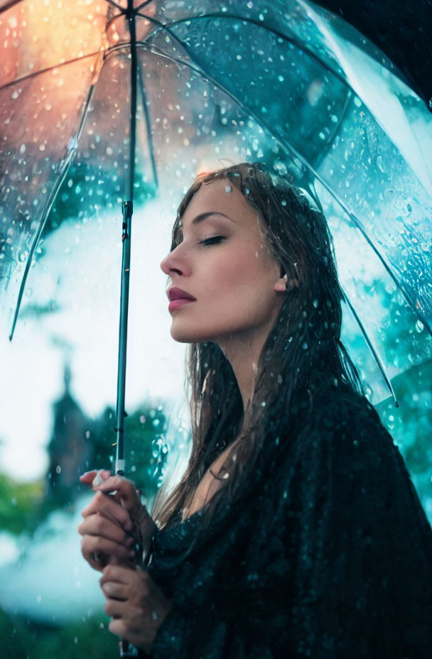 Woman with transparent umbrella in rain, thoughtful expression, blurred nature background