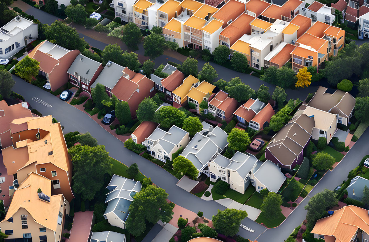 Suburban neighborhood with diverse houses, trees, and winding roads.