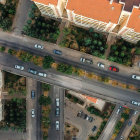 Residential Area with Houses, Roads, Trees, and Farmland Contrast