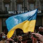 Large Ukrainian Flag Waving Over Crowd