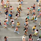 Diverse group crossing street in colorful attire