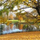 Colorful Autumn Landscape: Foliage Reflecting in Tranquil Lake