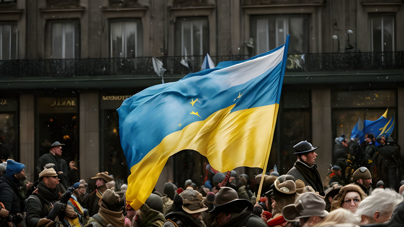 Large Ukrainian Flag Waving Over Crowd