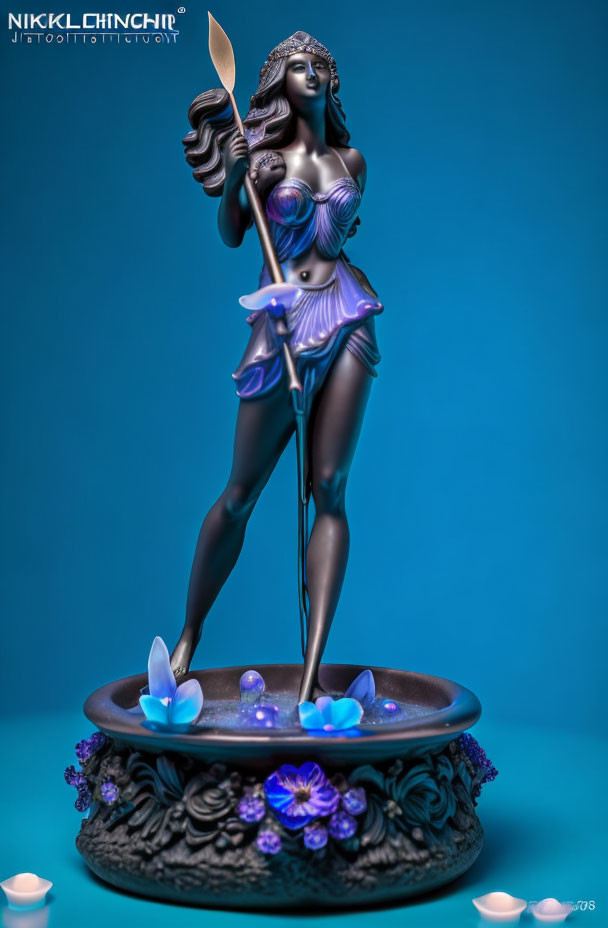 Stylized dark-skinned woman figurine with silver hair and purple attire holding spear and shield on