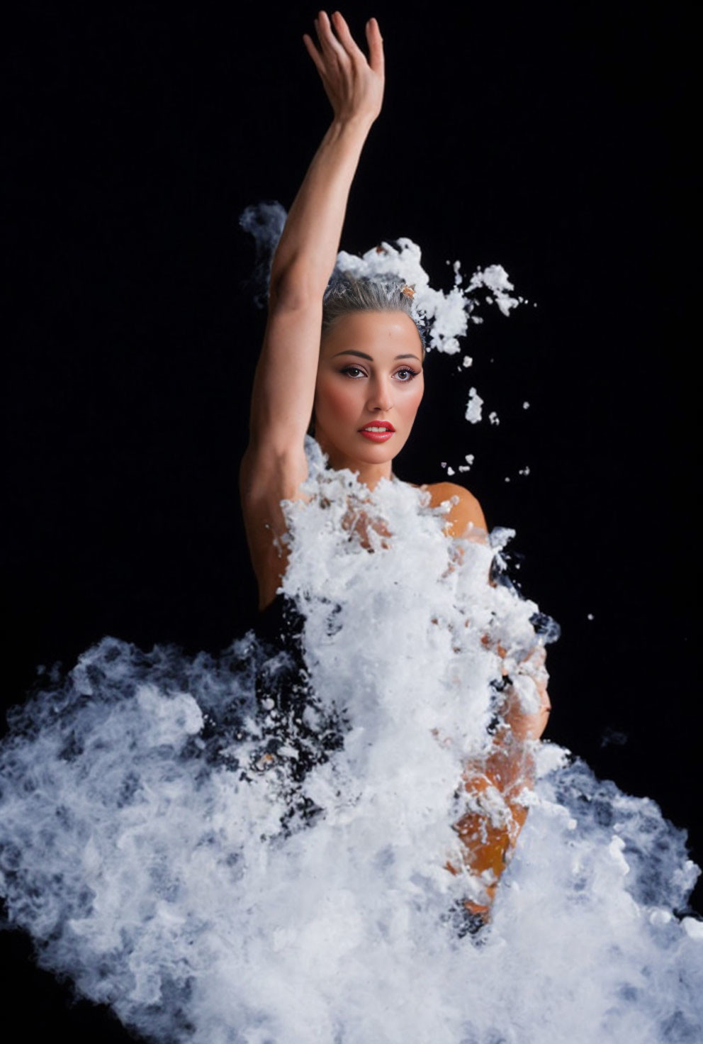 Dynamic pose of woman emerging from splashing water