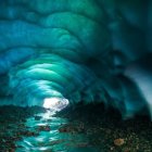 Stunning Blue Ice Cave with Reflective Water Surface