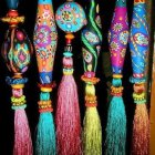 Colorful Tassels and Decorated Ceramic Vases Displayed on Dark Background