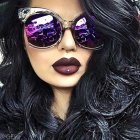 Woman in Reflective Sunglasses Surrounded by Vibrant Colors