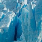 Icy Landscape with Turquoise Lights and Frozen Formations