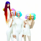 Five stylized female characters in sparkling dresses with star headpieces and colorful wavy hair on white background