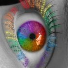 Detailed illustration of eye with rainbow iris and mystical aura