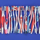 Colorful Cutlery Handles Displayed on Purple Background