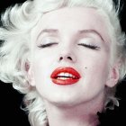 Portrait of person with platinum blonde hair, red lipstick, glittery eye makeup, statement earrings on dark