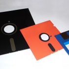 Various Sizes of Floppy Disks on White Background