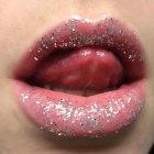 Textured pink and red crystalline makeup design on lips