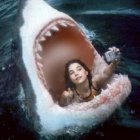 Surreal underwater scene: two people taking a selfie inside giant shark's mouth