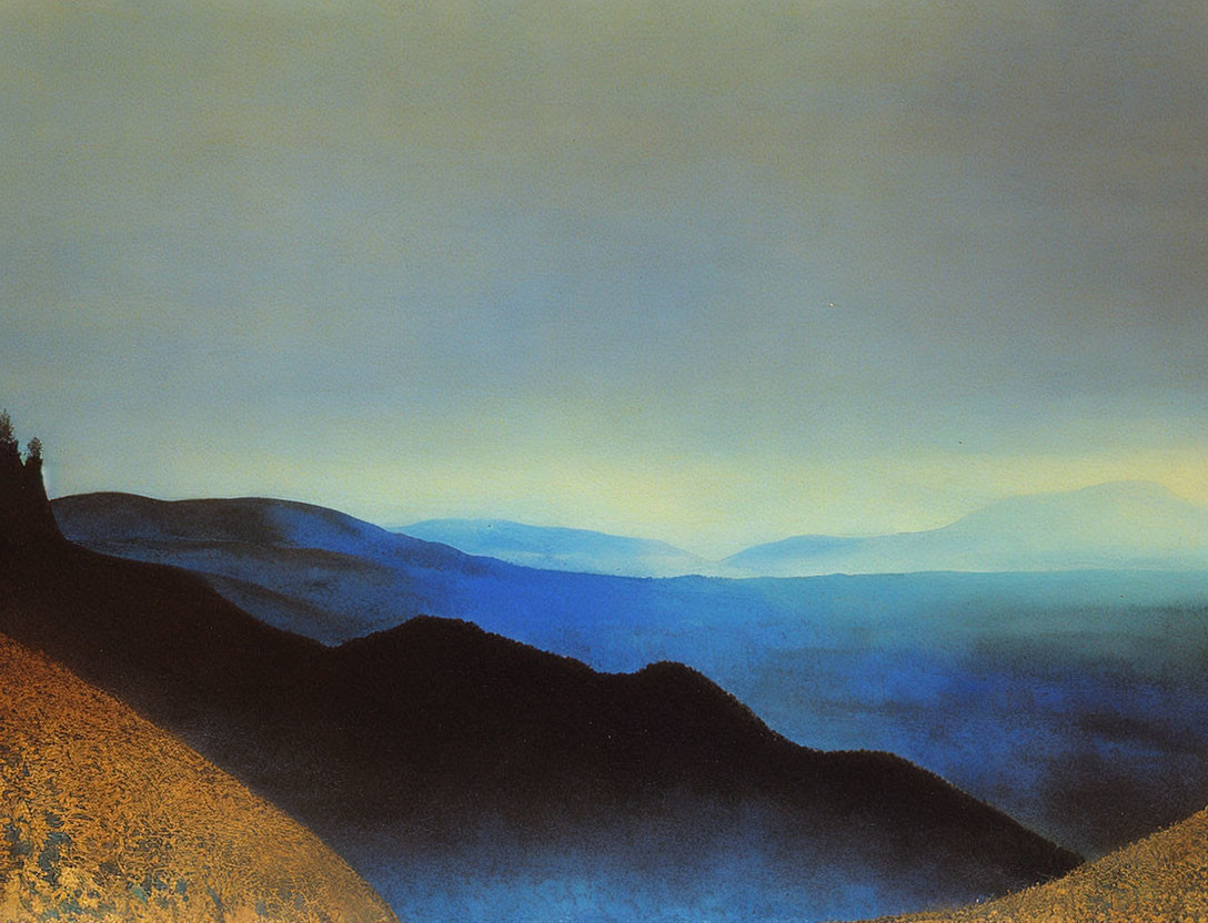 Blue mountain landscape under twilight sky with shadowed foreground