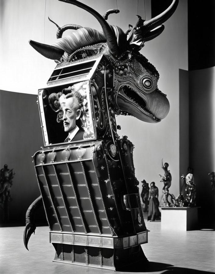 Surreal black and white photo of bizarre sculpture with man's head and animal parts