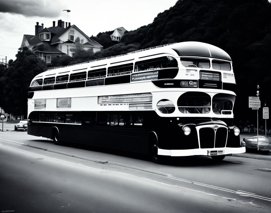 Vintage Double-Decker Bus on Street with Hill Houses in Black and White