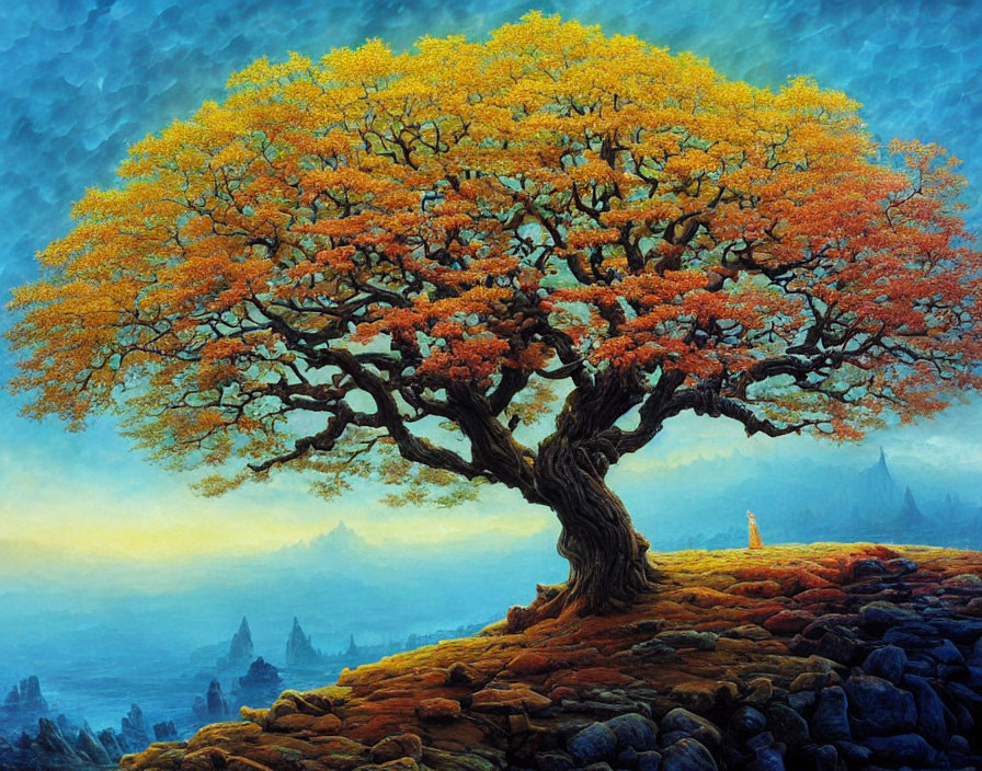 Large Vibrant Tree with Golden Foliage on Rocky Terrain Under Blue Sky