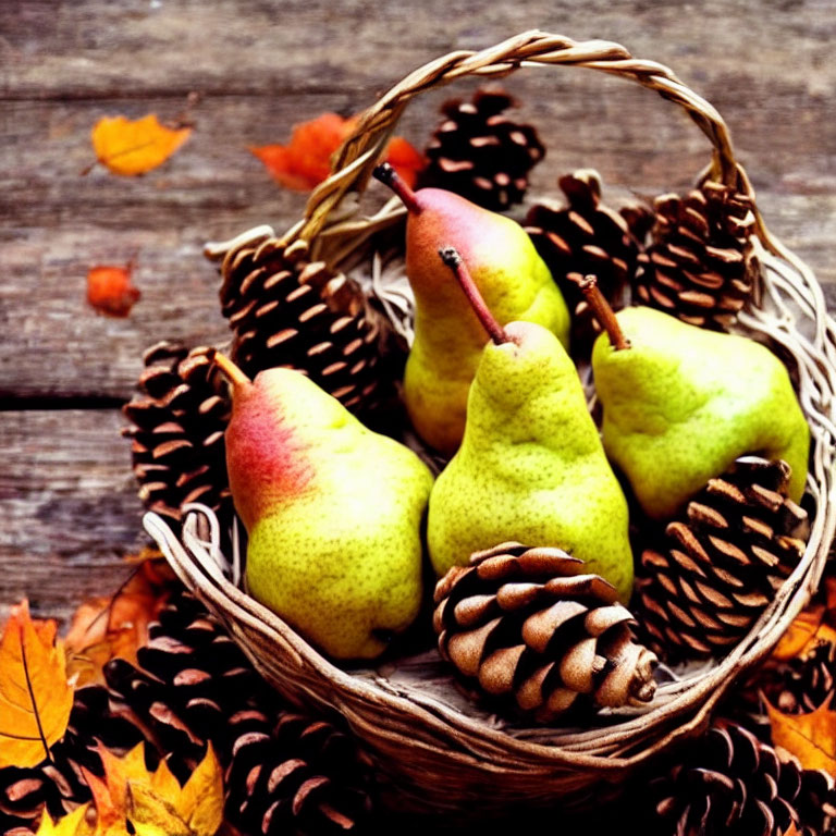 Rustic basket with ripe pears, pinecones, and autumn leaves on wooden surface