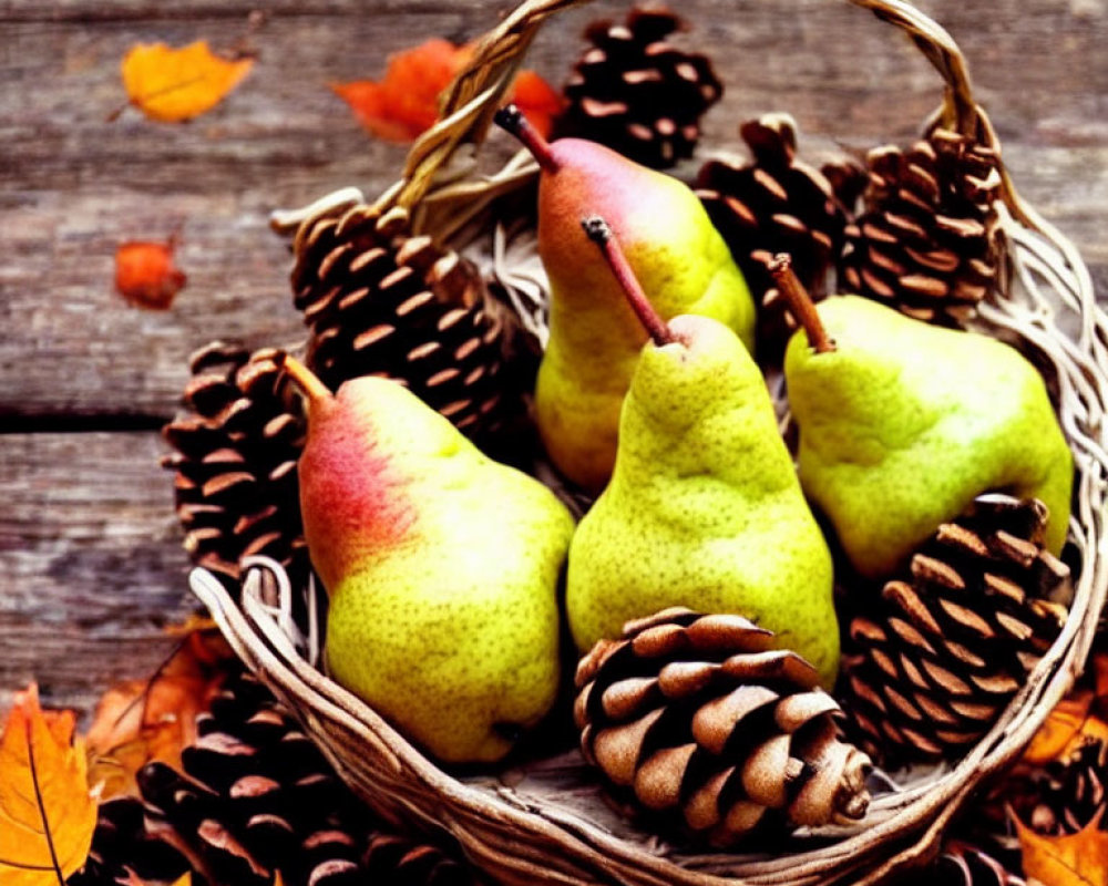 Rustic basket with ripe pears, pinecones, and autumn leaves on wooden surface