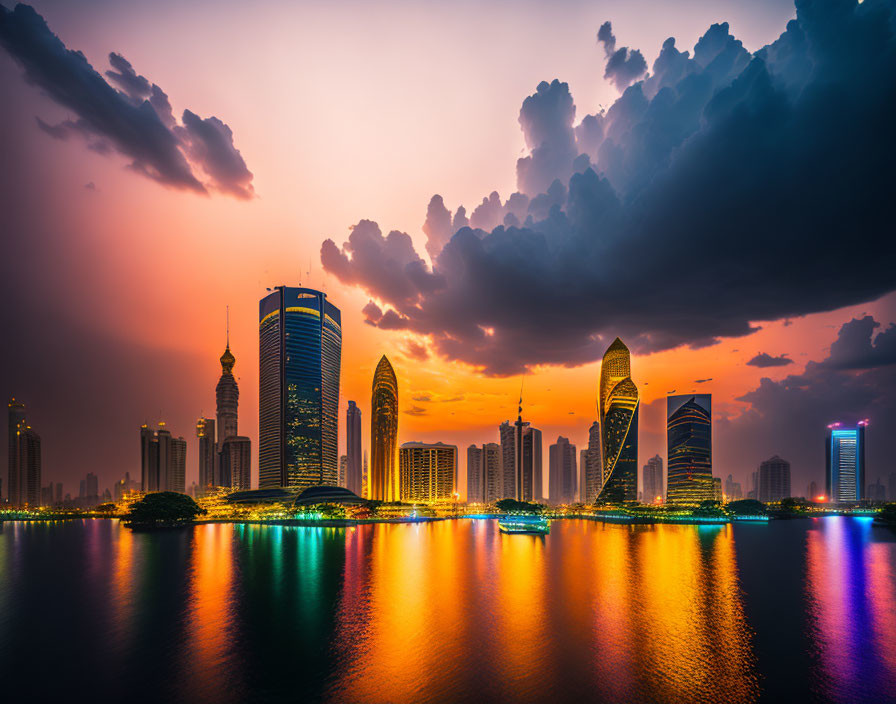 City skyline at sunset with skyscrapers reflected on water under orange and purple sky