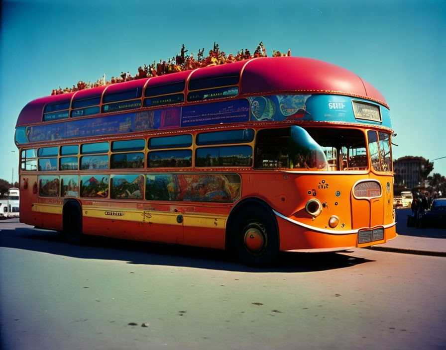 Vibrant double-decker bus with colorful designs under clear blue sky