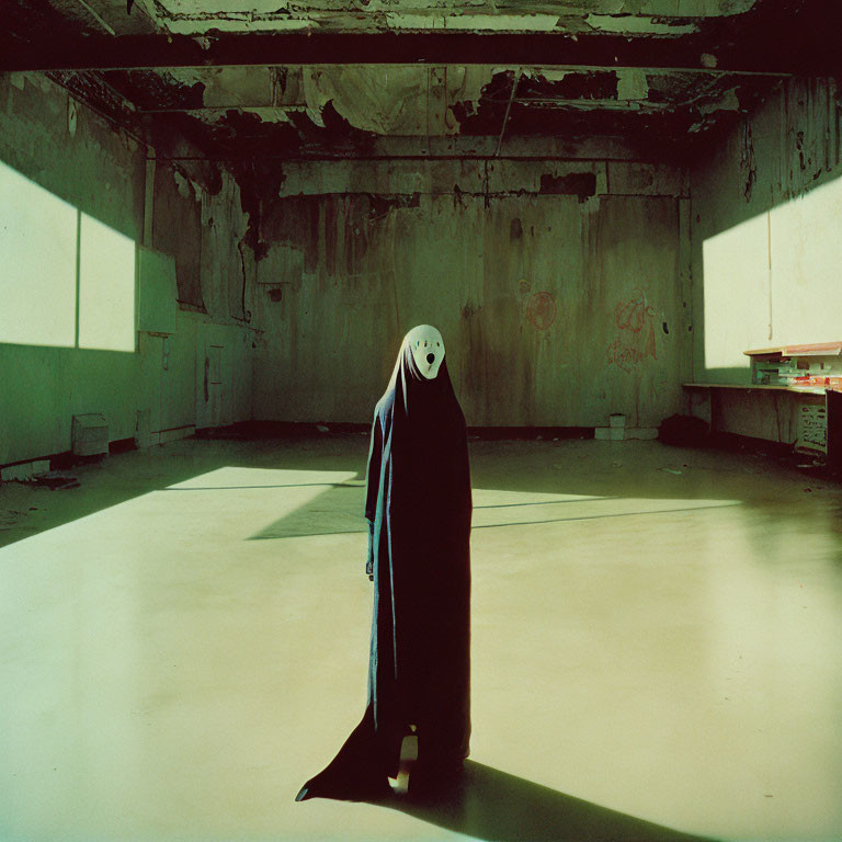 Cloaked figure with white mask in graffiti-covered room