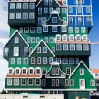 Whimsical Dutch architecture painting with blue sky