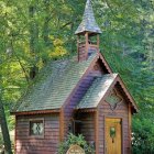 Stone cottage with red door in forest clearing