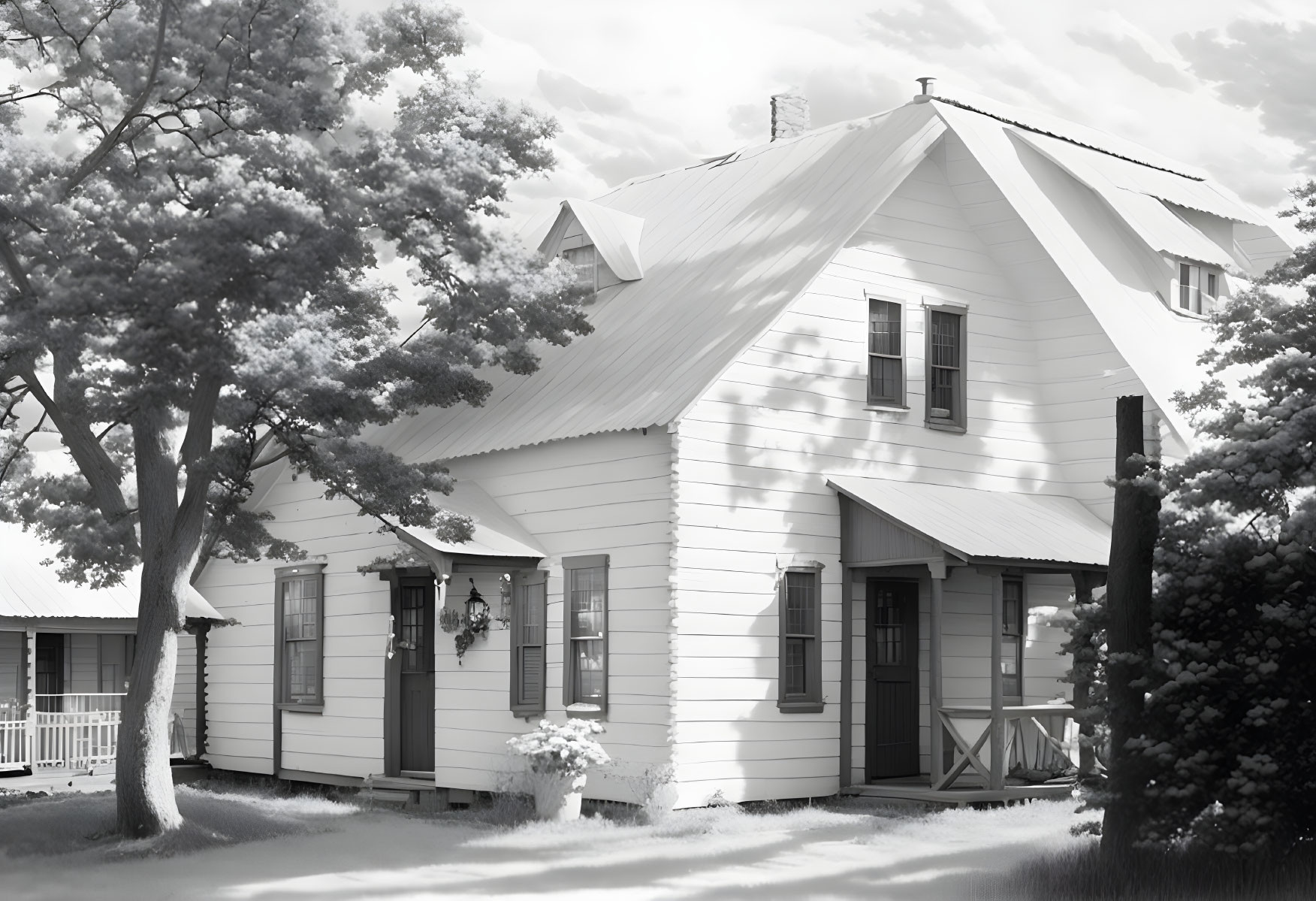 Monochromatic image: quaint two-story house, porch, trees, white picket fence