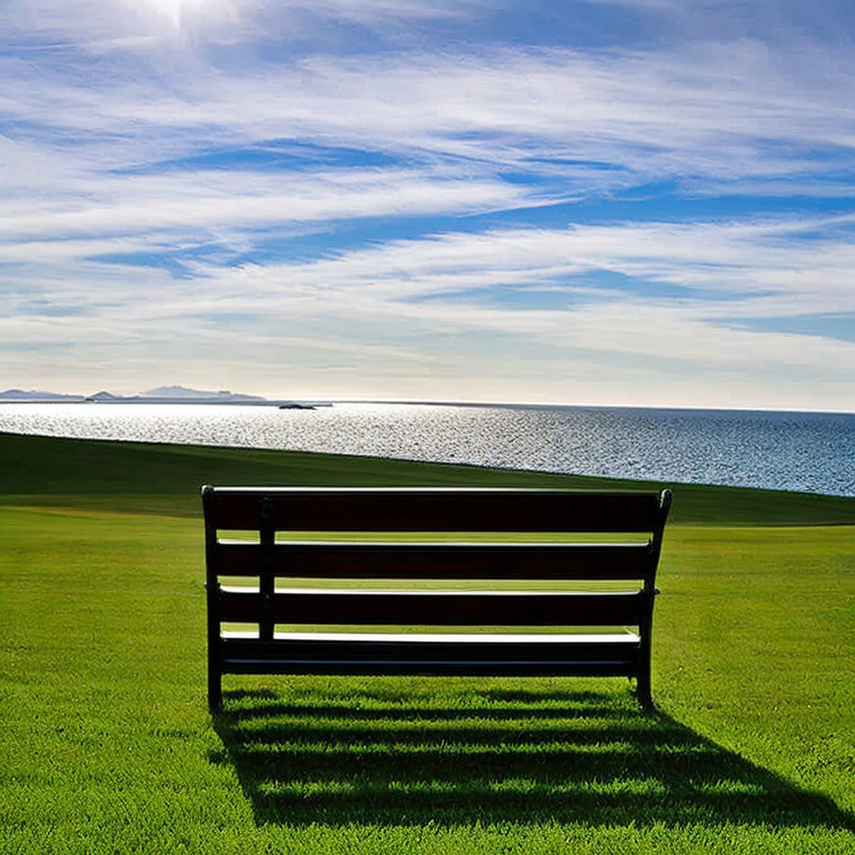 Tranquil sea view from empty bench with clear horizon and sunny sky