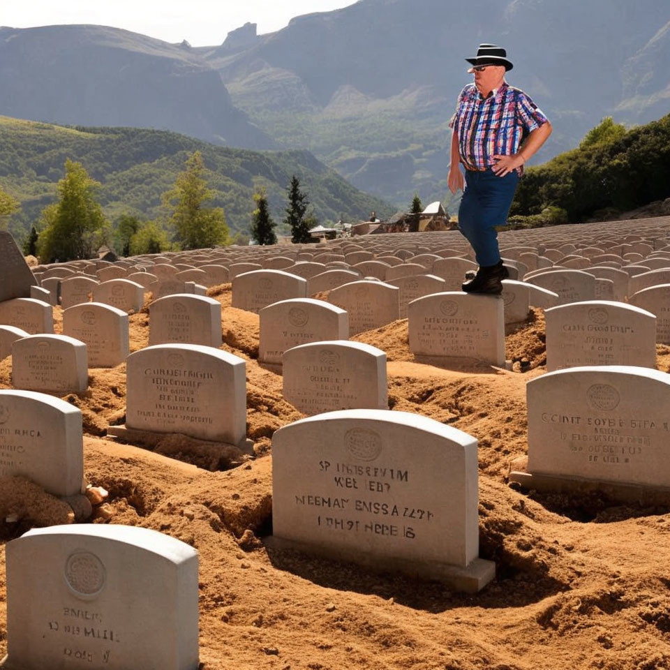 Man in Hat Walking Among Rows of Gravestones with Mountains