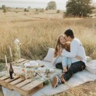 Surreal picnic scene with oversized fruit, tiny elephants, curious animals, and floating islands