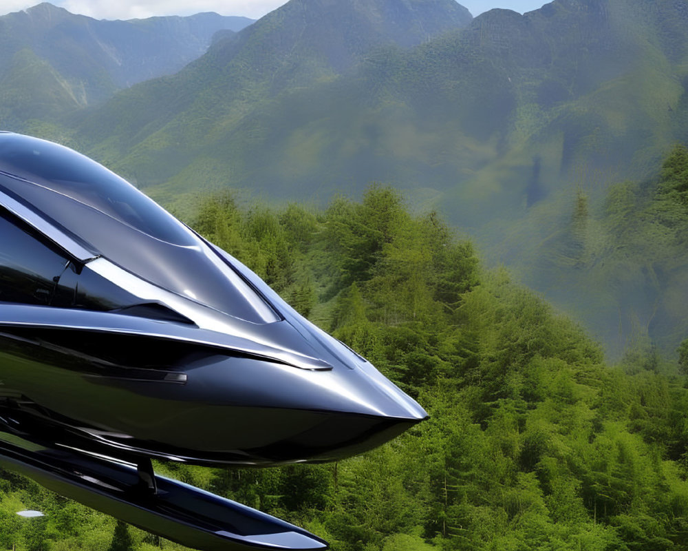 Sleek black aircraft flying over lush green mountains