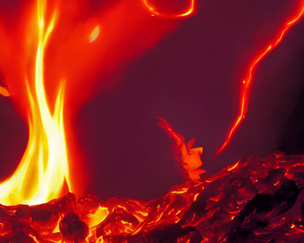 Vibrant orange and yellow flames on glowing coals against dark backdrop