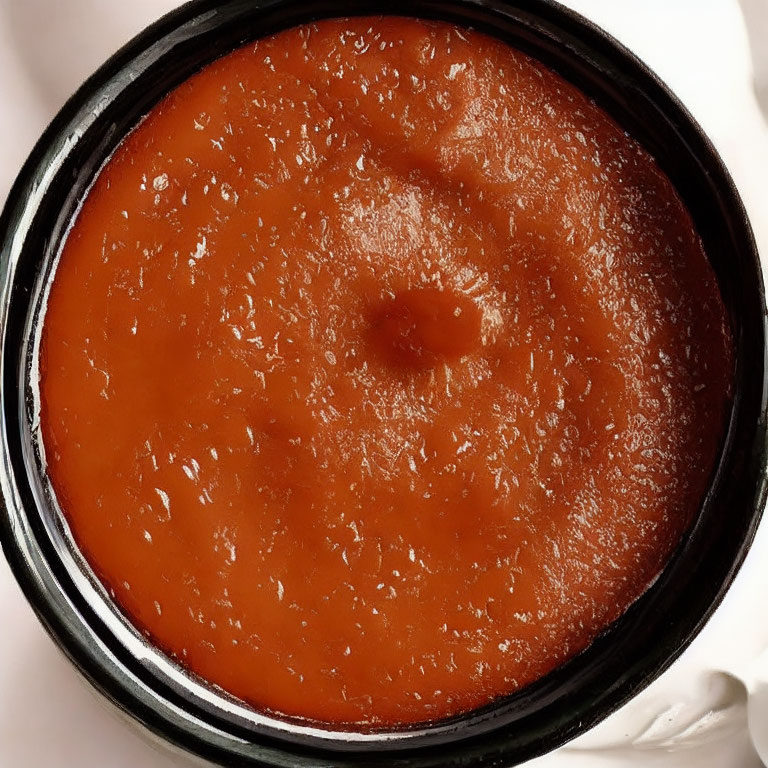 Bright Orange Tomato Soup in Bowl with Creamy Texture