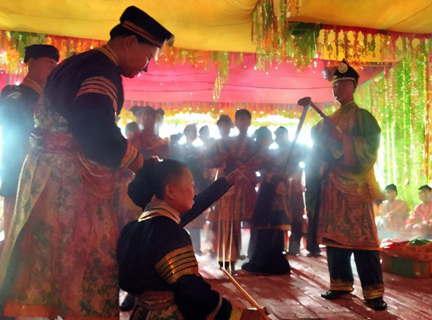 Traditional Attire Ceremony with Colorful Decor and Audience